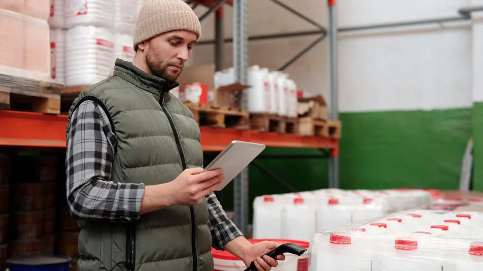 Warehouse lead recording inventory on a tablet